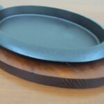 Oval sizzling platter with wooden base