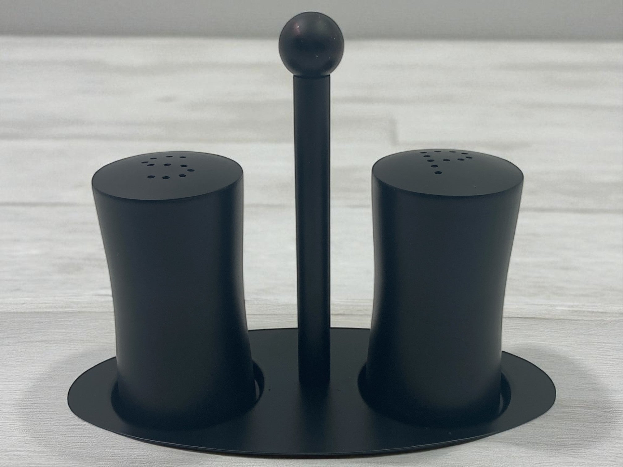 eca256cc8a9551ea7d6fee9ac6e82f4a.jpg Mat Black Stainless Steel Salt and Pepper Set on Stand