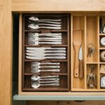 Thirty-piece stainless cutlery set laid out in a wooden sliding drawer tray — The Cutlery Drawer for Twelve bundle